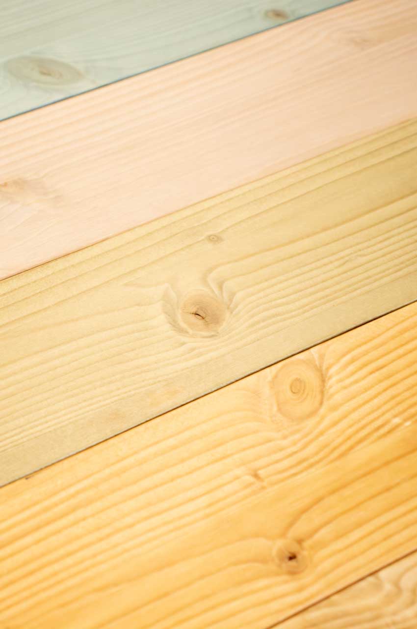 Wooden boards stained with different water-based paints for furniture
