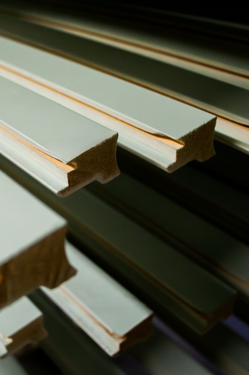 Different sections of frames coated with water-based spray primers for frames.