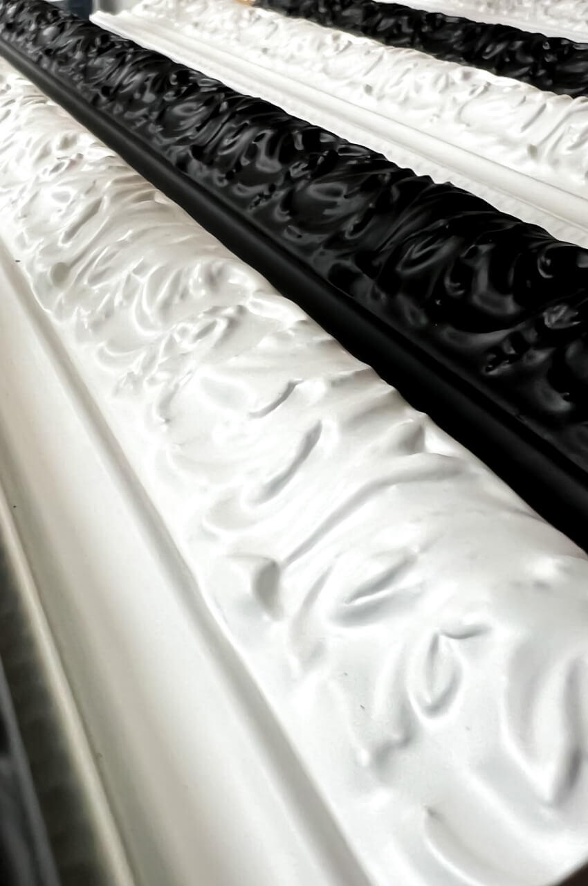 Black and white frames treated with solvent-based spray primers for frames