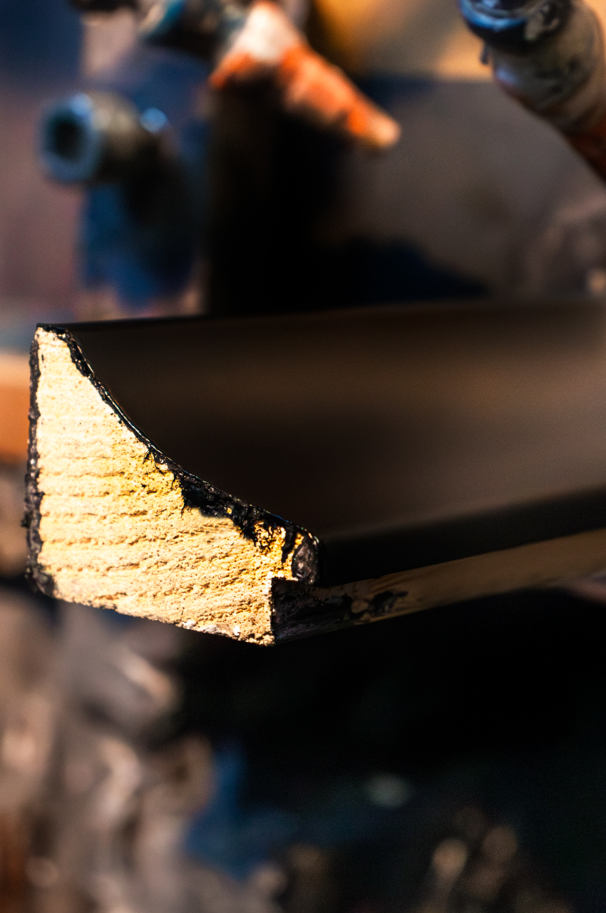 Section of a frame colored with solvent-based extruder primer